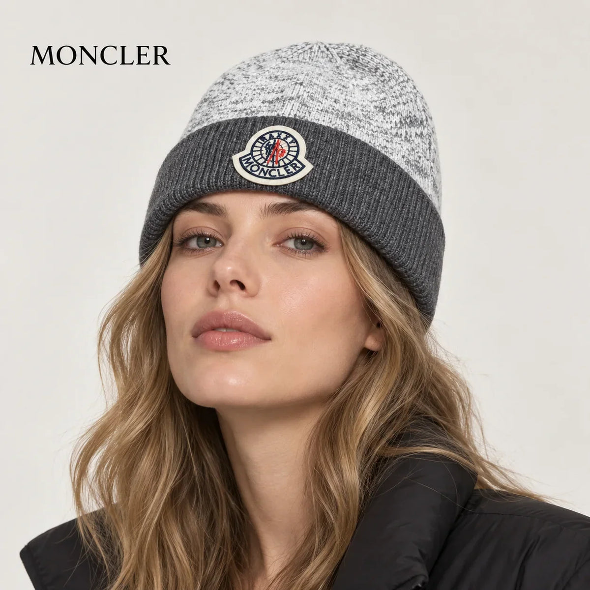 Moncler hat worn by a female model, showing the hat shape and detailing.