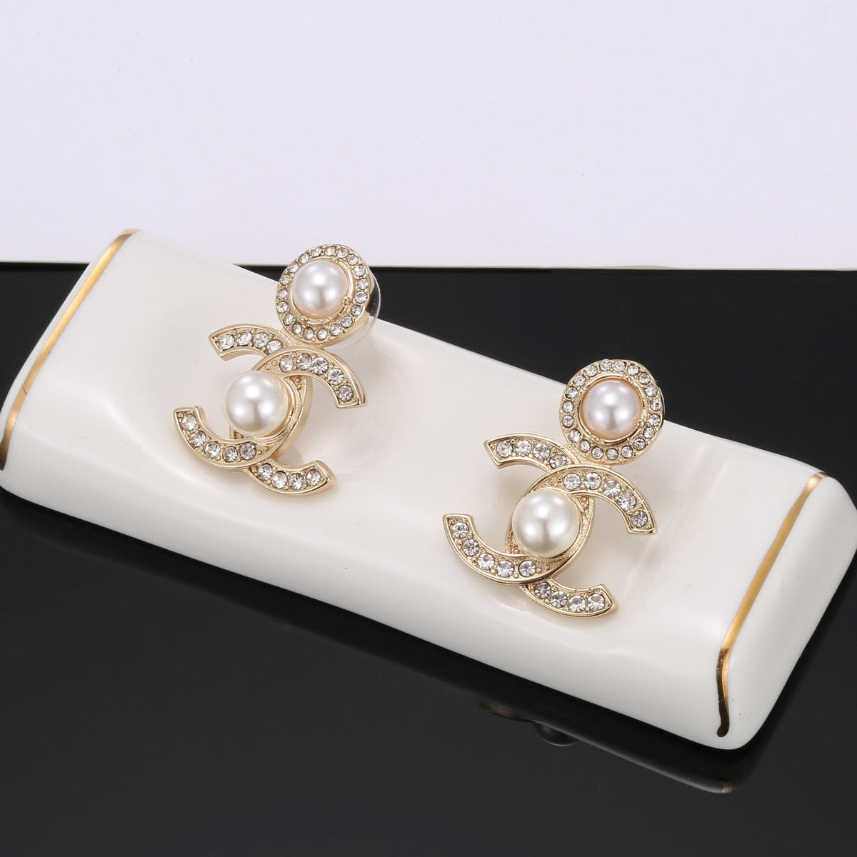 Martin Graham stud earrings in polished metal-tone – main product view