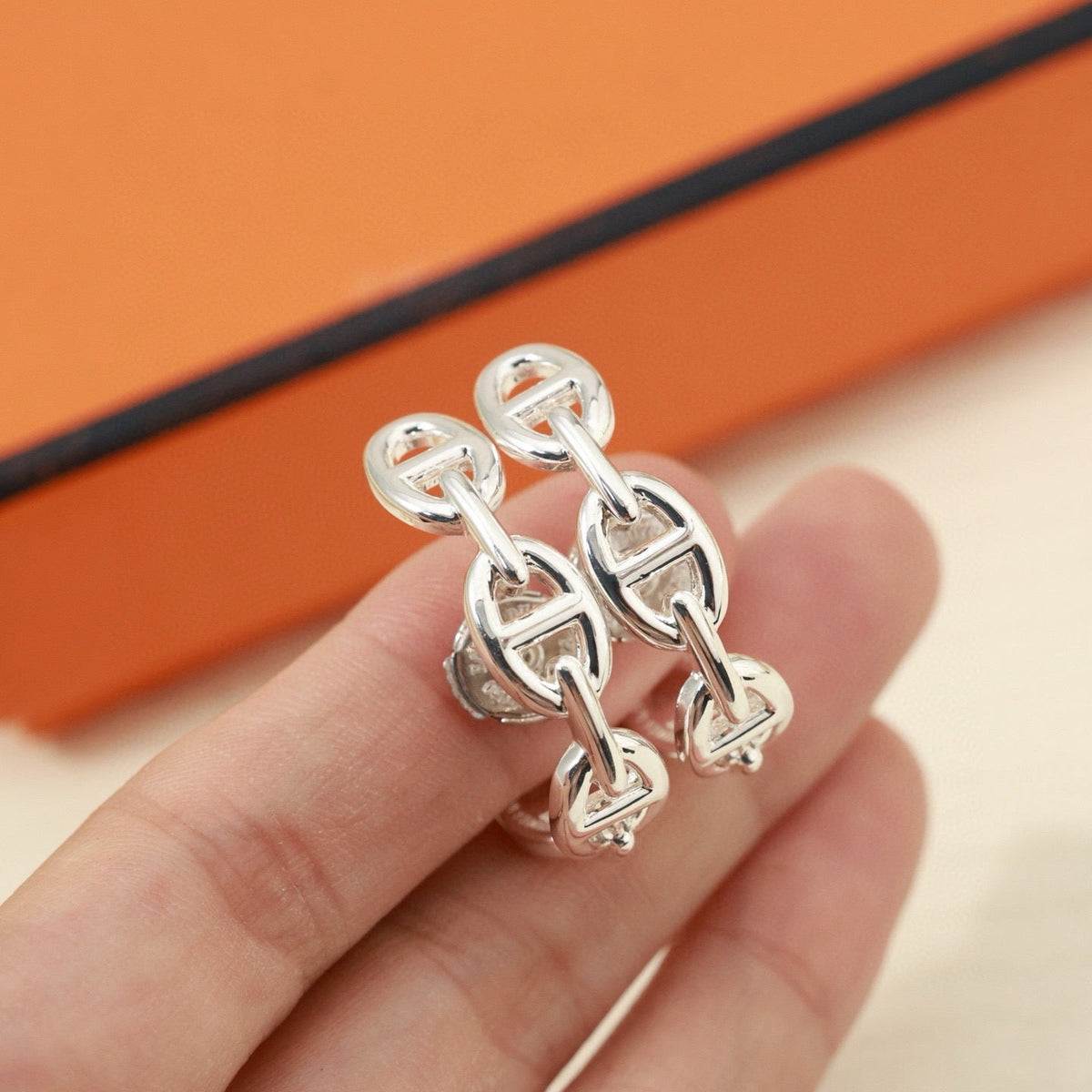 Martin Graham stud earrings in polished metal-tone – main product view