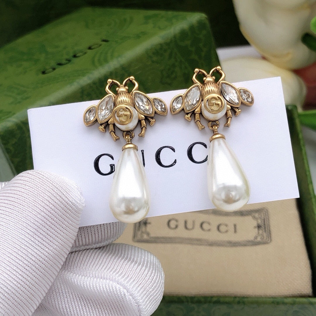 Martin Graham stud earrings in polished metal-tone – main product view