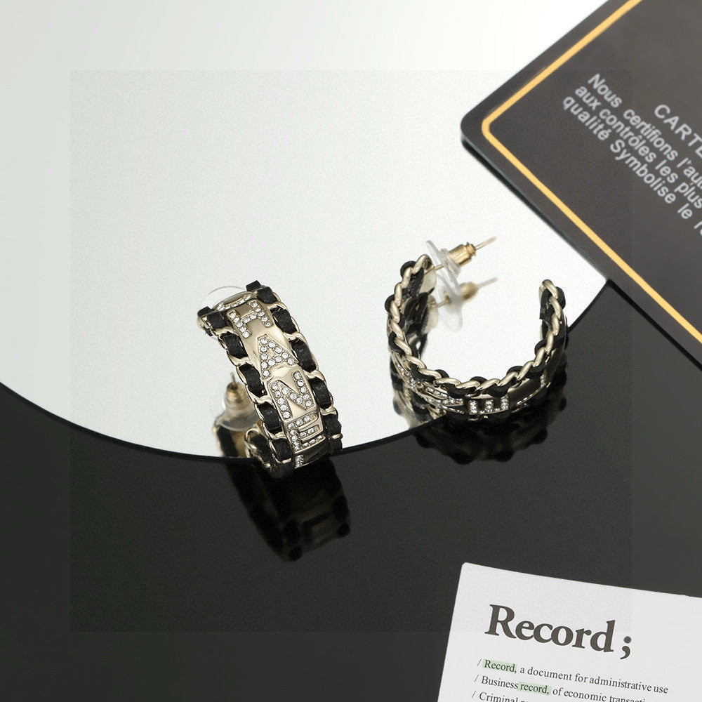 Martin Graham stud earrings in polished metal-tone – main product view