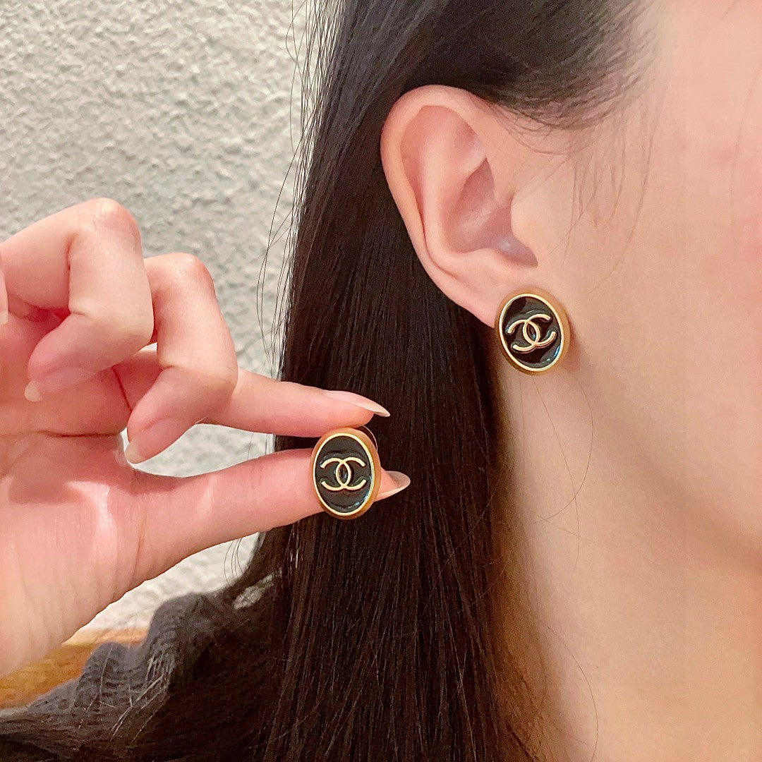Martin Graham stud earrings in polished metal-tone – main product view