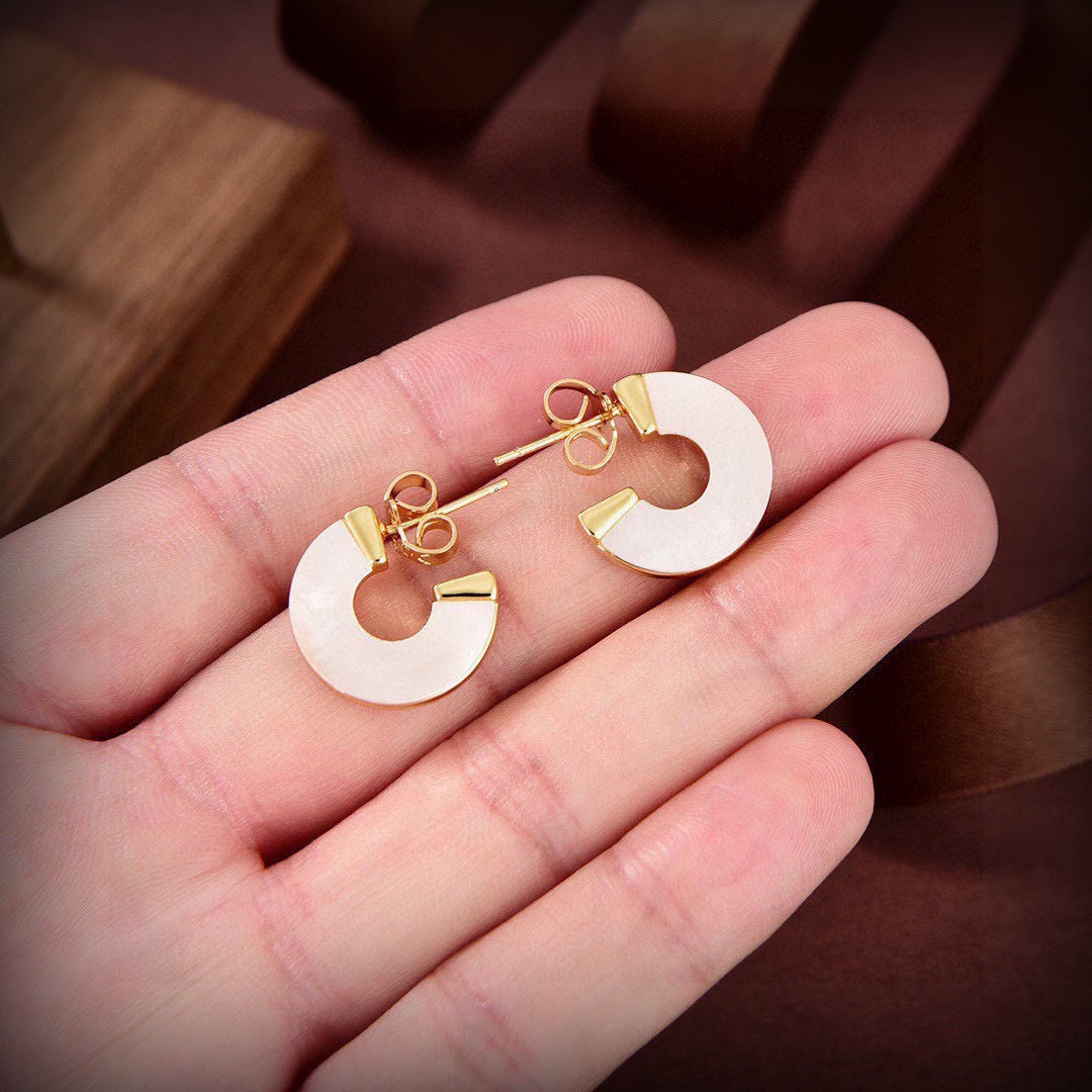 Martin Graham stud earrings in polished metal-tone – main product view