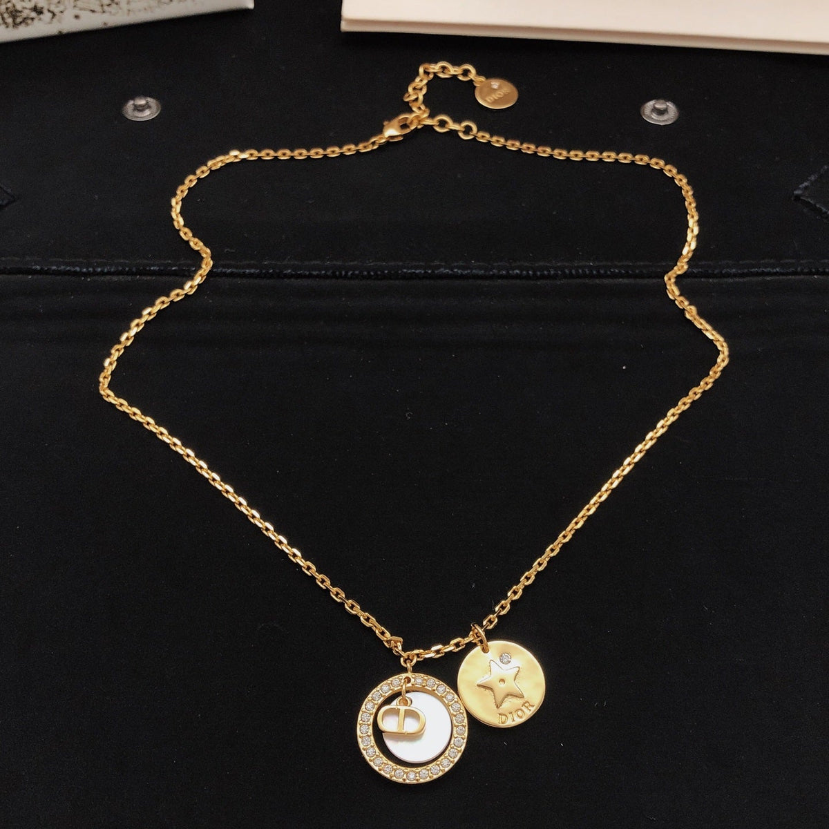 Martin Graham pendant necklace in polished metal-tone – side detail
