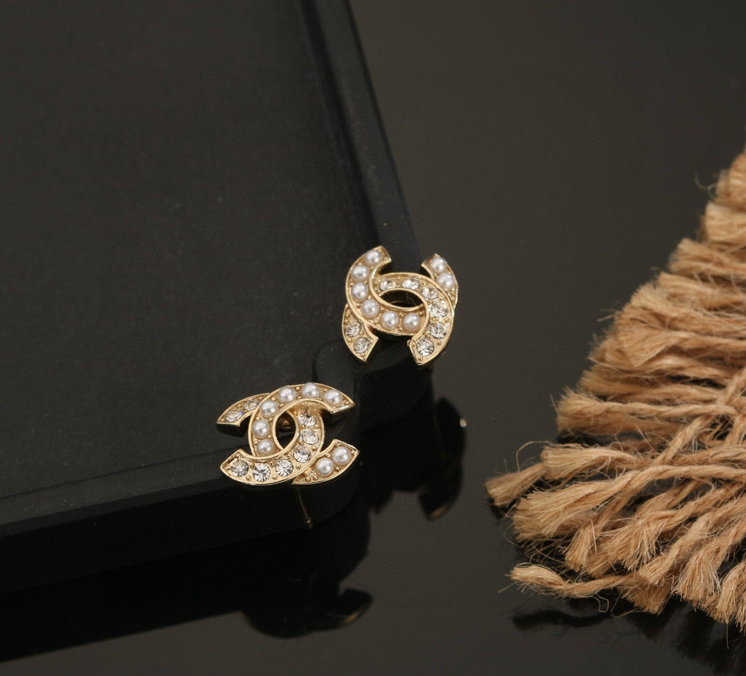 Martin Graham stud earrings in polished metal-tone – styled product view
