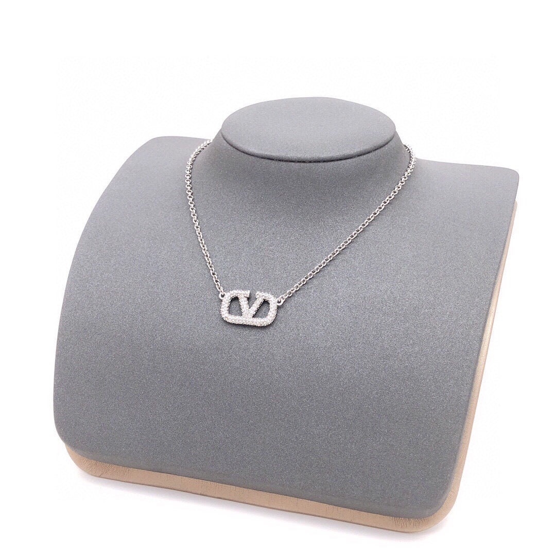 Martin Graham pendant necklace in polished metal-tone