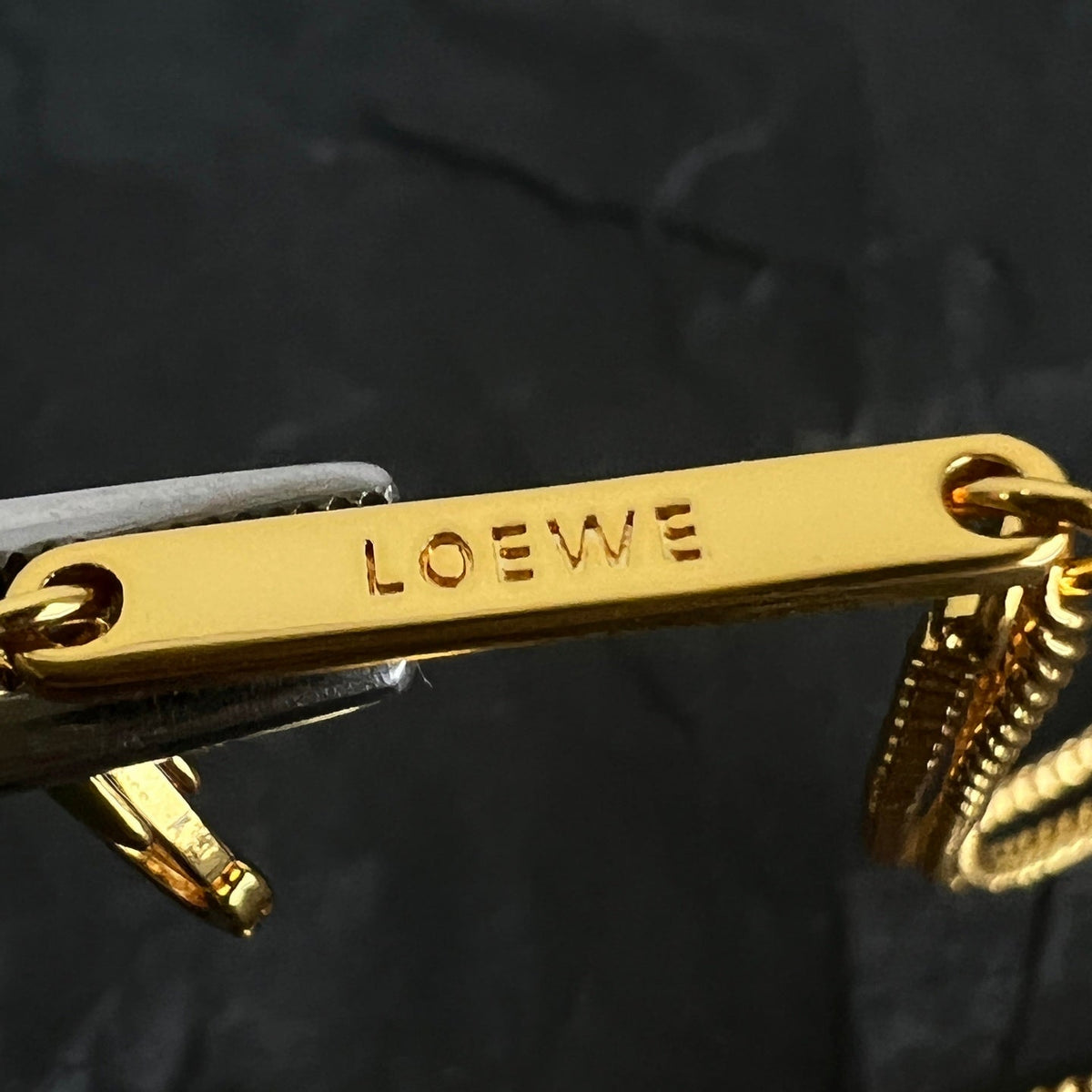 Martin Graham pendant necklace in polished metal-tone – close-up detail