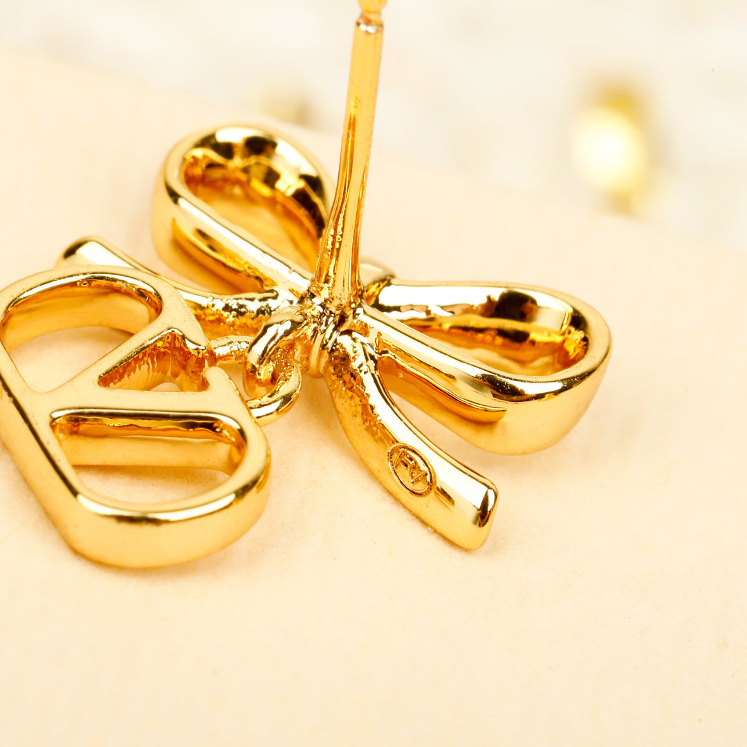 Martin Graham earrings in polished metal-tone
