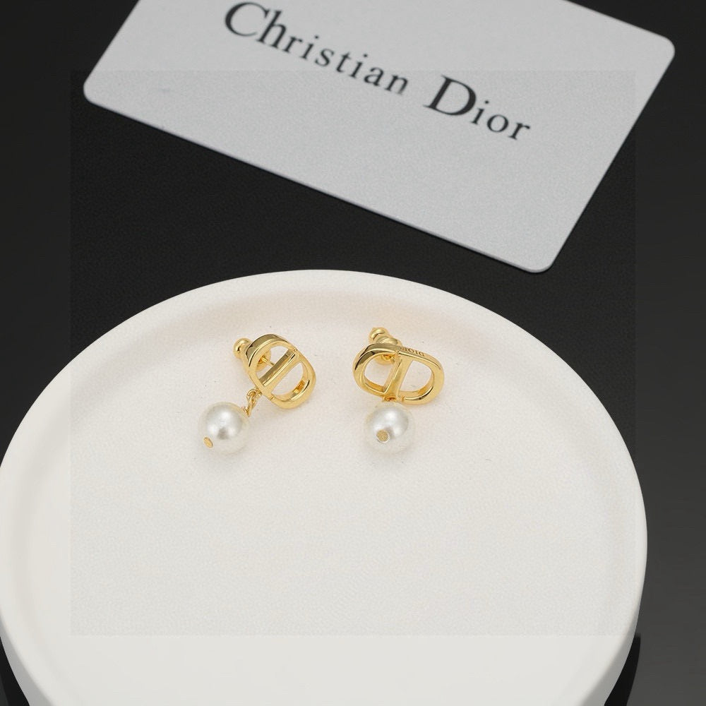 Martin Graham stud earrings in polished metal-tone – front view