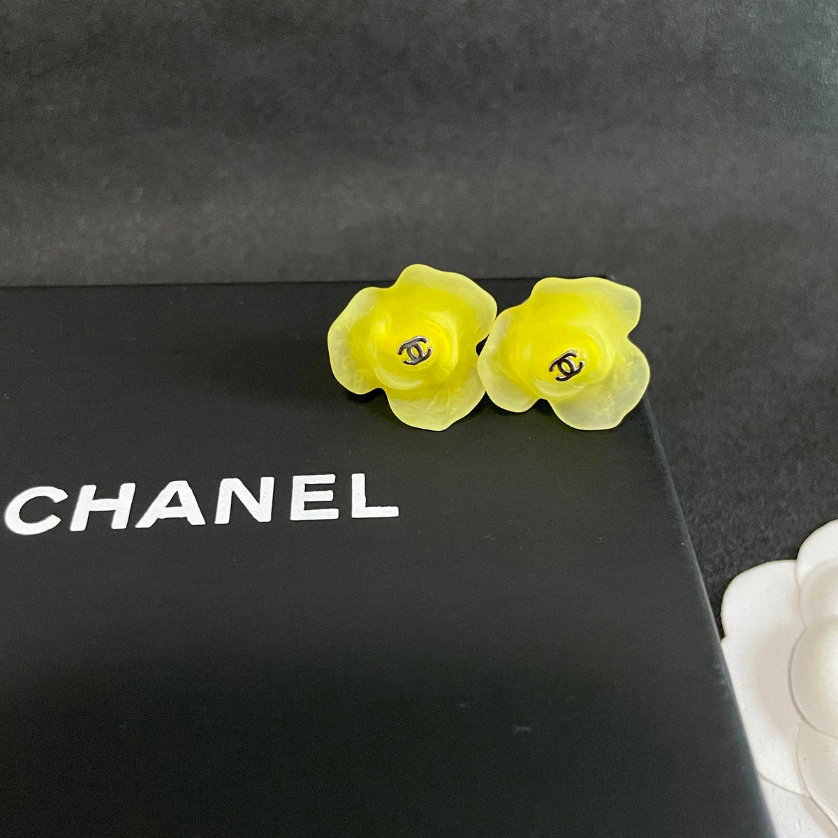 Martin Graham stud earrings in polished metal-tone – detail view