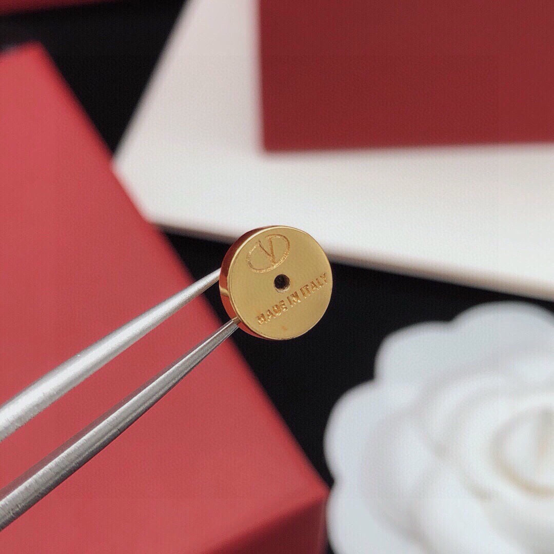 Martin Graham stud earrings in polished metal-tone – detail view