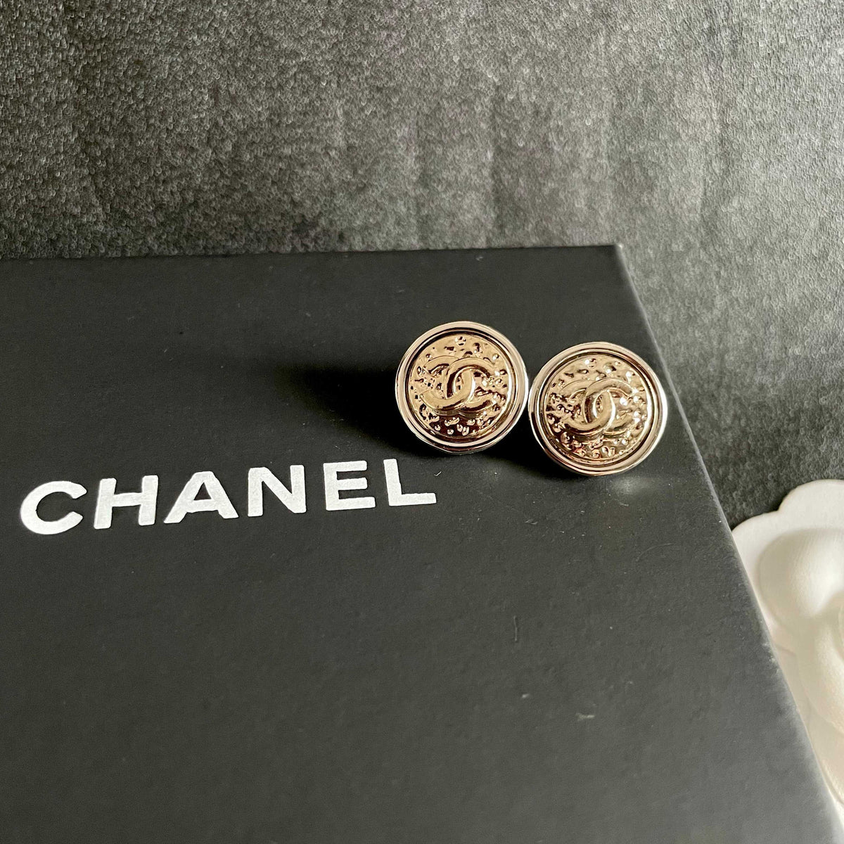 Martin Graham stud earrings in polished metal-tone – detail view