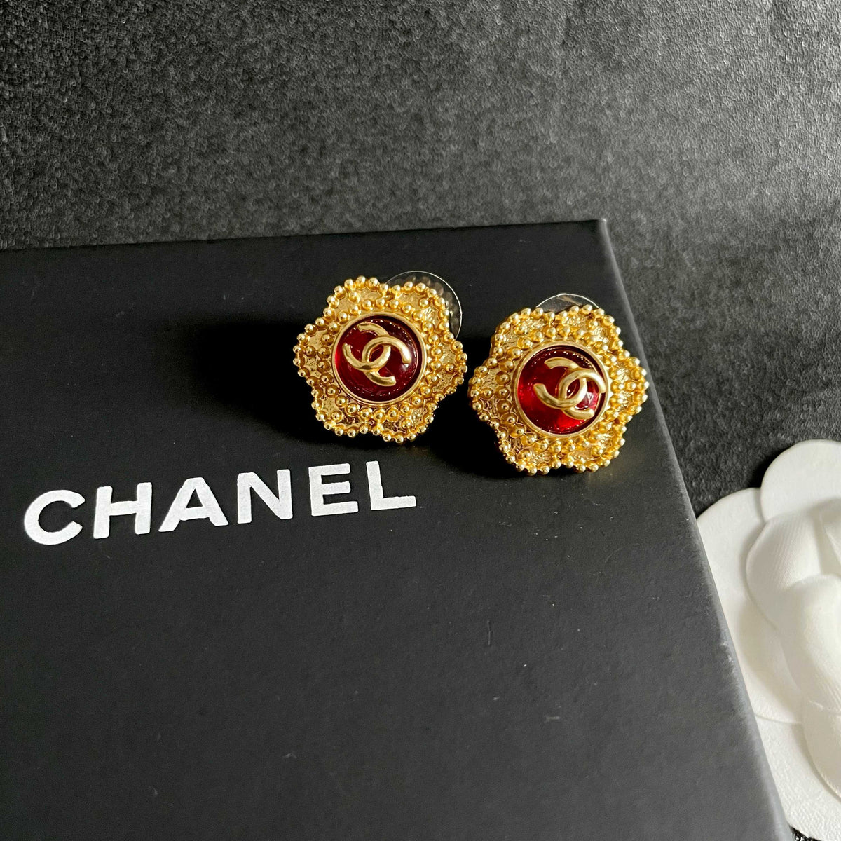 Martin Graham stud earrings in polished metal-tone – detail view