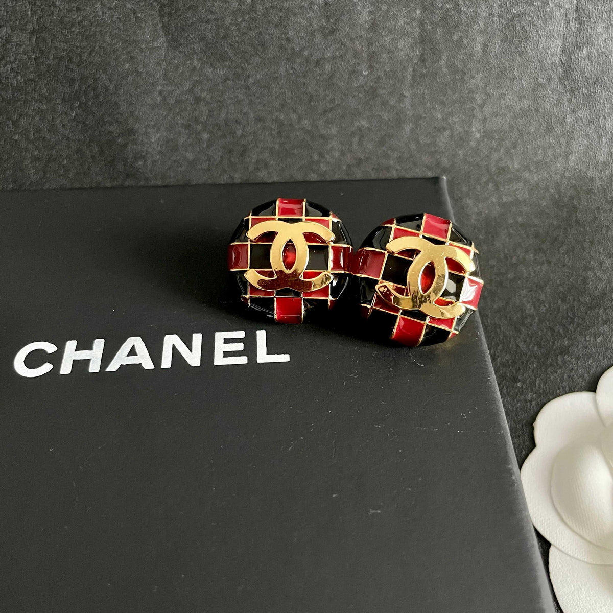 Martin Graham stud earrings in polished metal-tone – detail view