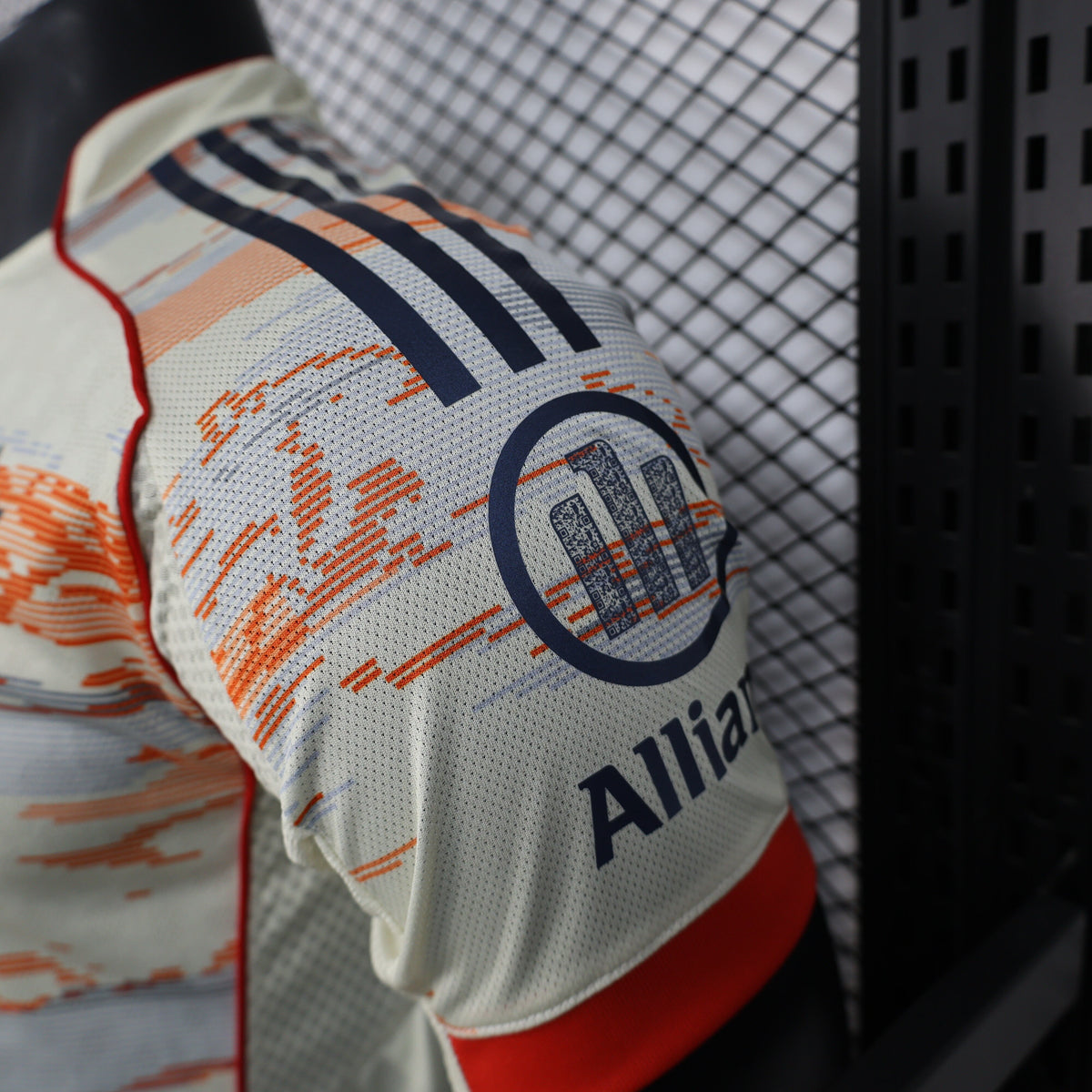 2025/26 Bayern Munich Away Player Version Jersey -  Body Orange Grey Horizontal Brush Stroke Graphic  - Red Side Seam Piping Red Sleeve Cuffs Black Shoulder Stripes - FC Bayern Crest - Deutsche Telekom T Logo