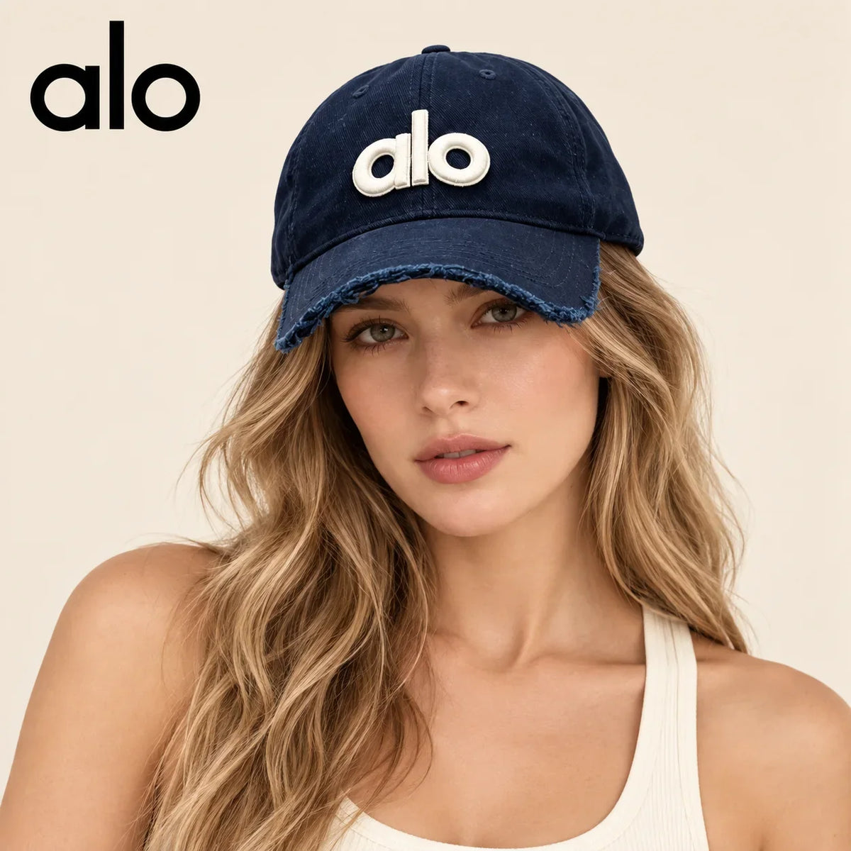 Model wearing alo baseball cap on head