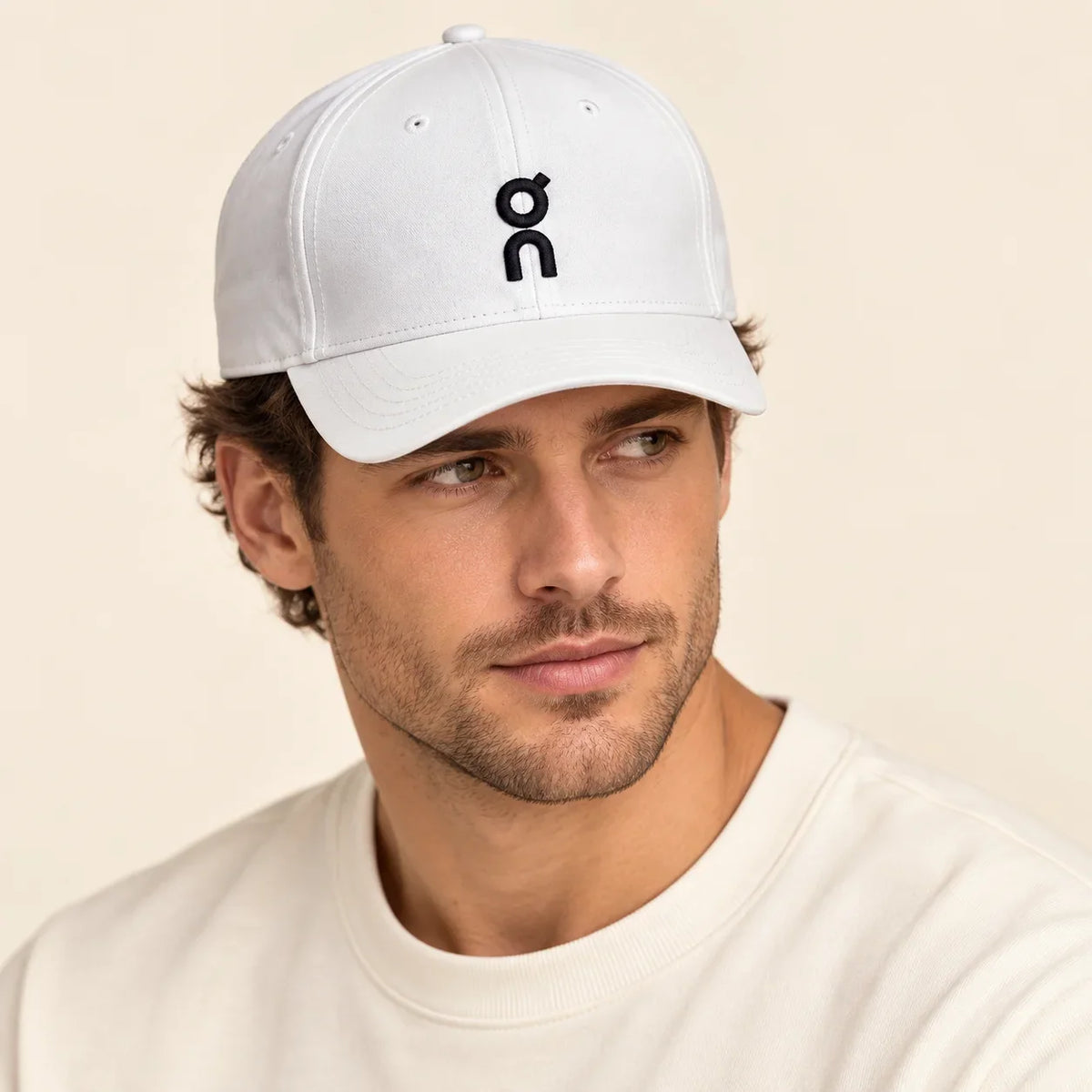 Model wearing baseball cap on head