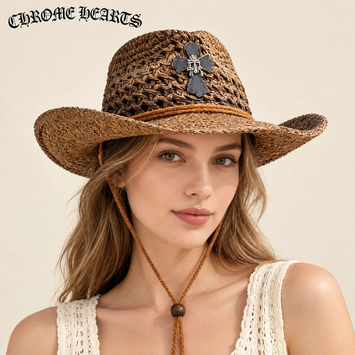 Model wearing chrome hearts straw hat on head