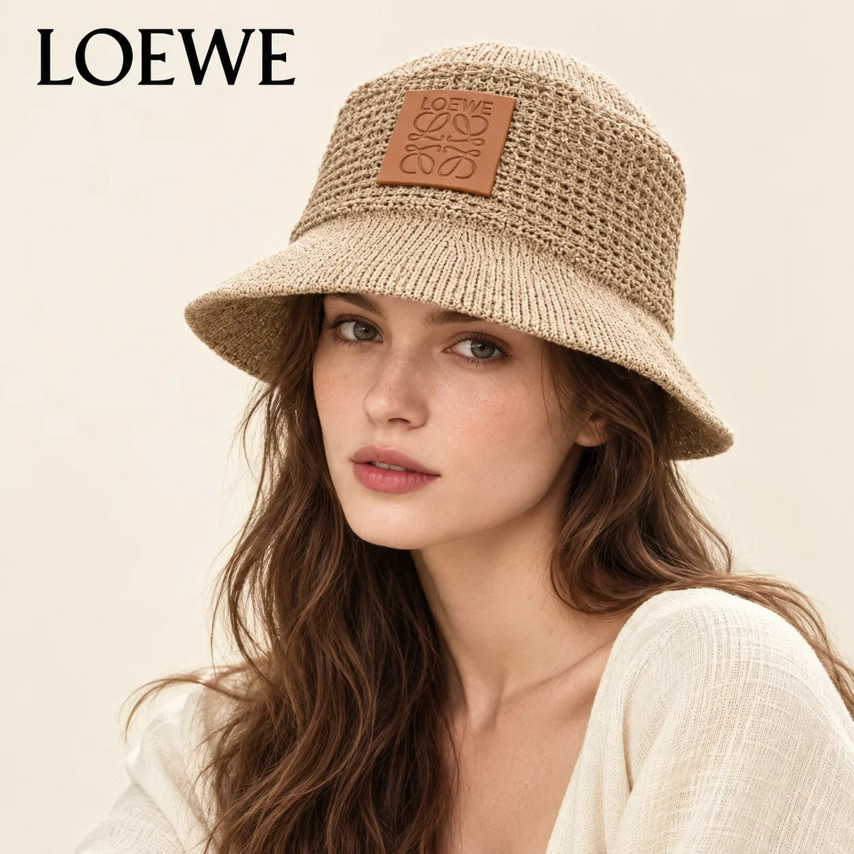 Model wearing loewe bucket hat on head