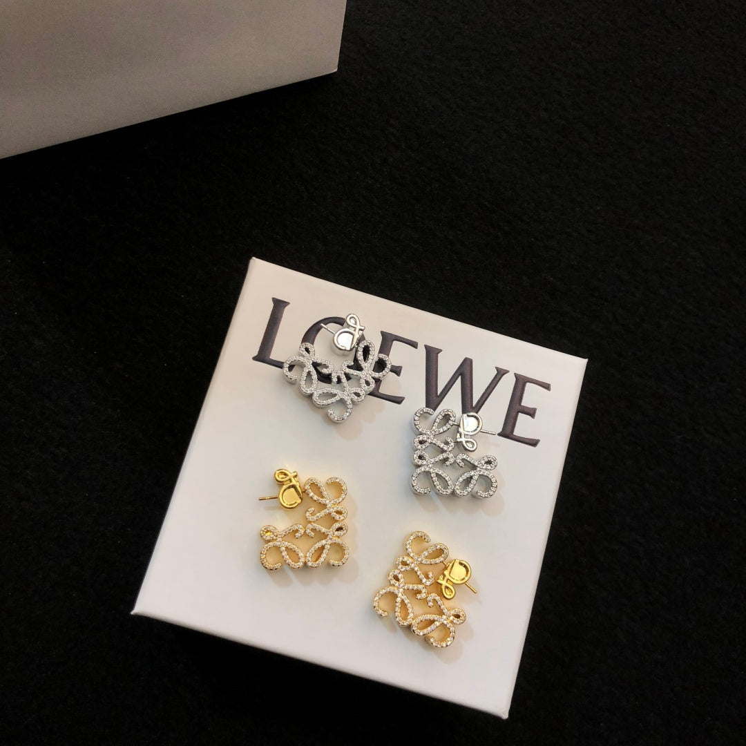 Martin Graham stud earrings in polished metal-tone – side detail
