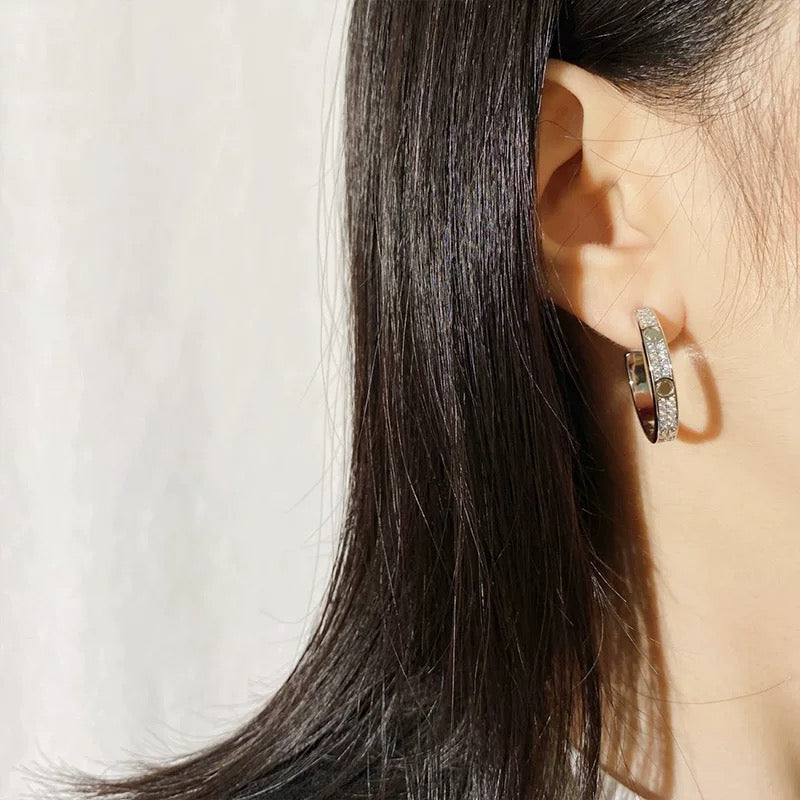 Martin Graham stud earrings in polished metal-tone