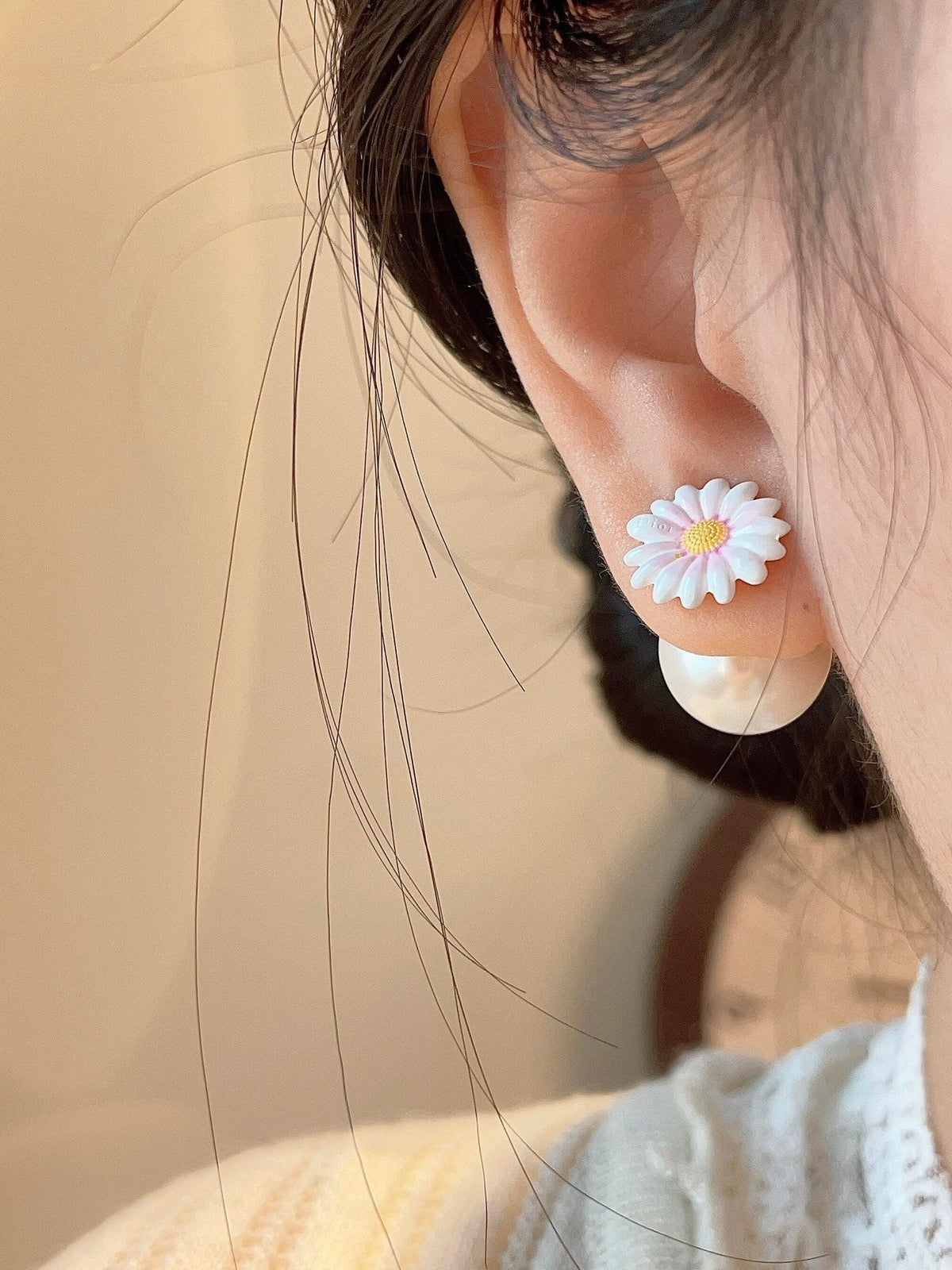 Martin Graham stud earrings in polished metal-tone – close-up detail