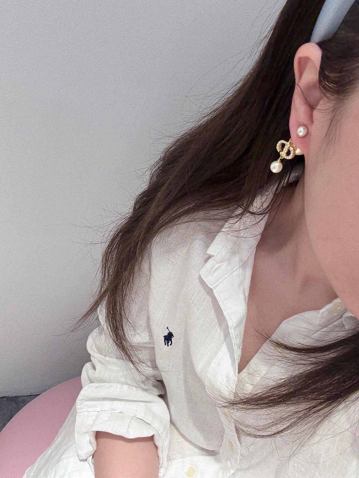 Martin Graham stud earrings in polished metal-tone – close-up detail