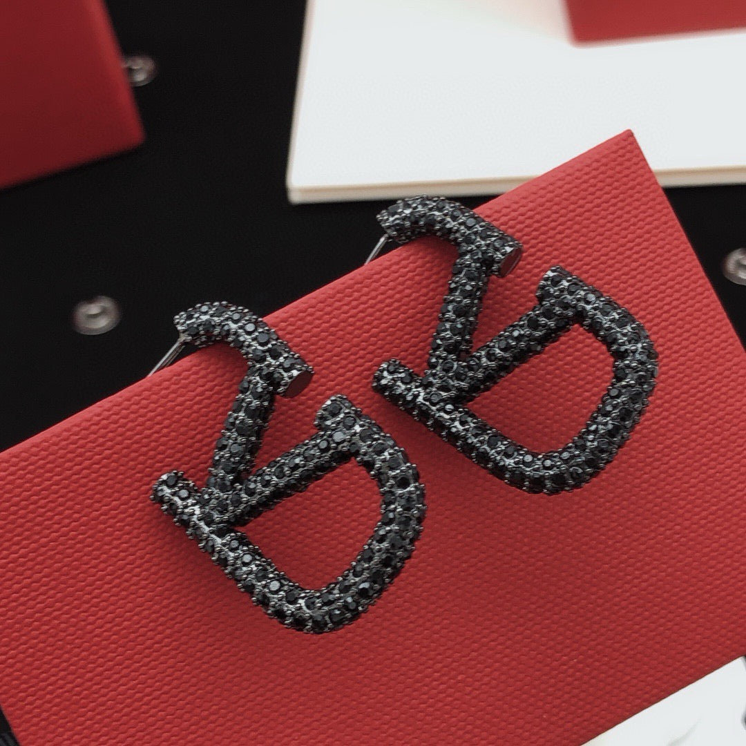 Martin Graham stud earrings in polished metal-tone – main product view