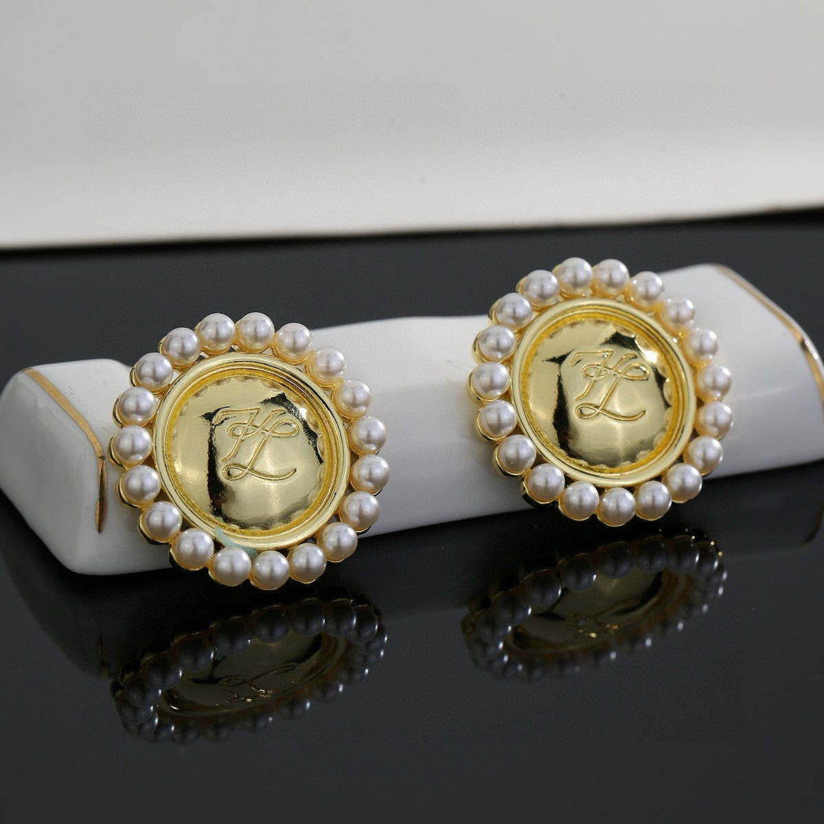 Martin Graham stud earrings in polished metal-tone – main product view