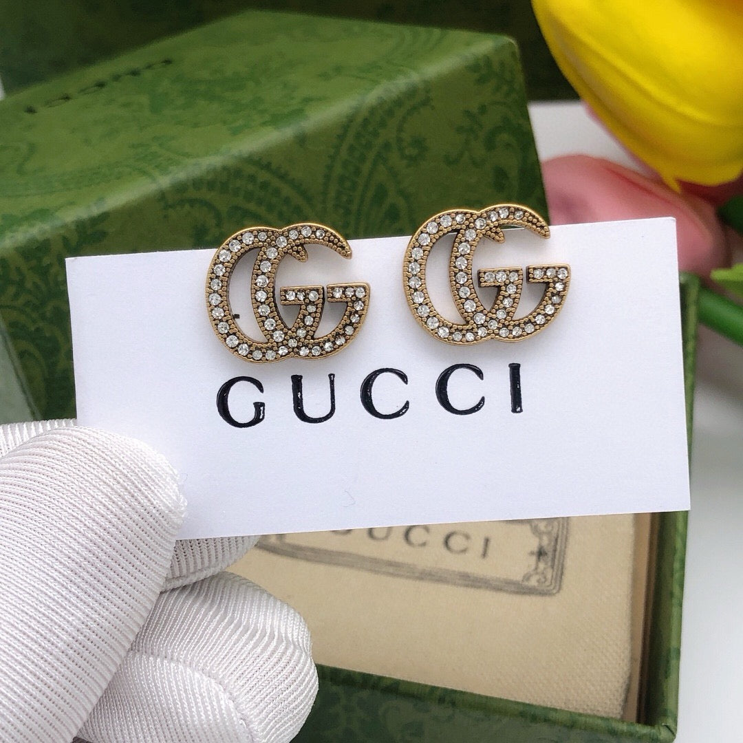 Martin Graham stud earrings in polished metal-tone – main product view