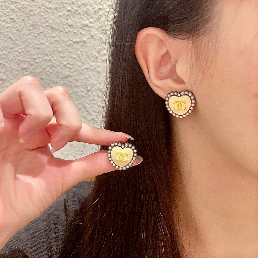 Martin Graham stud earrings in polished metal-tone – main product view