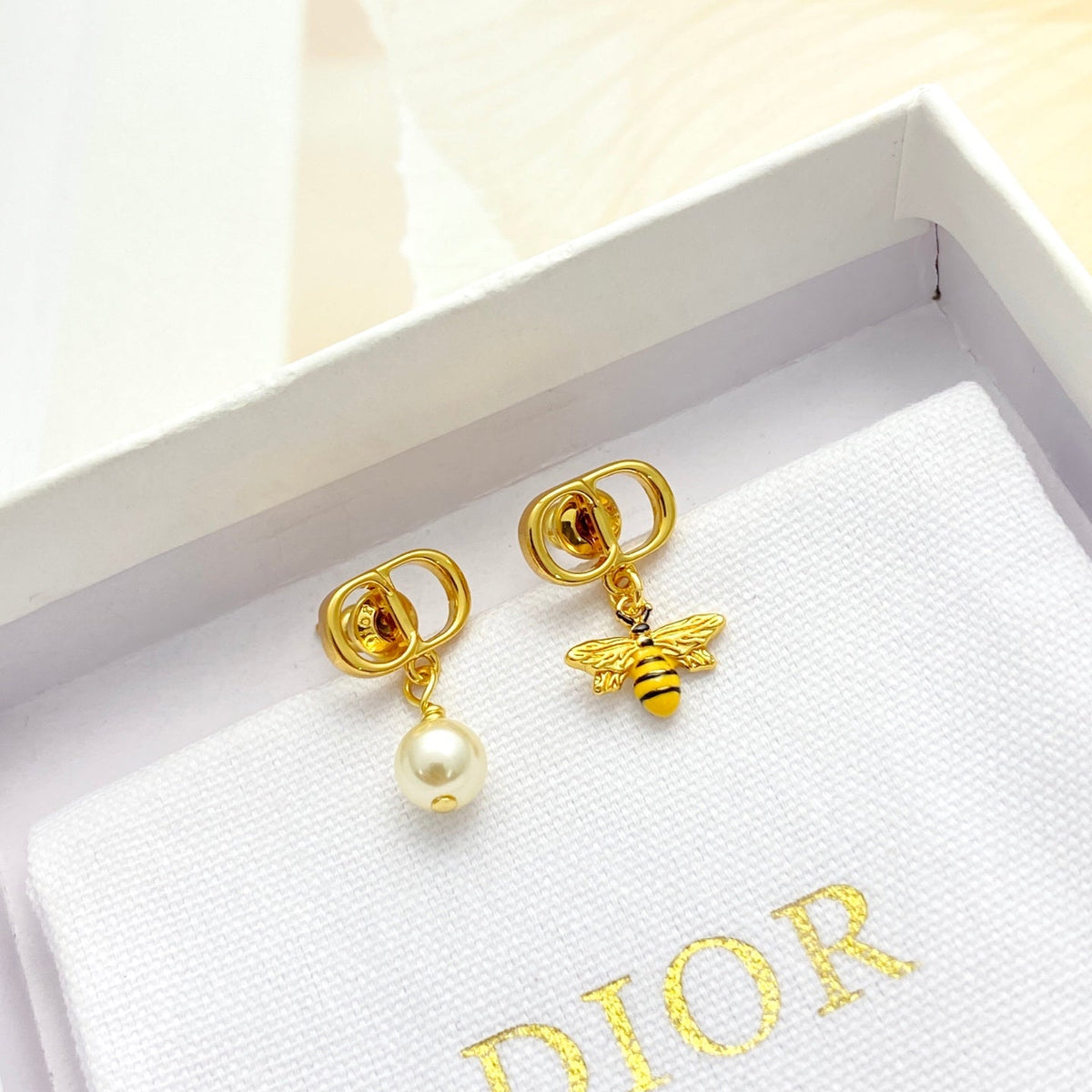 Martin Graham stud earrings in polished metal-tone – main product view