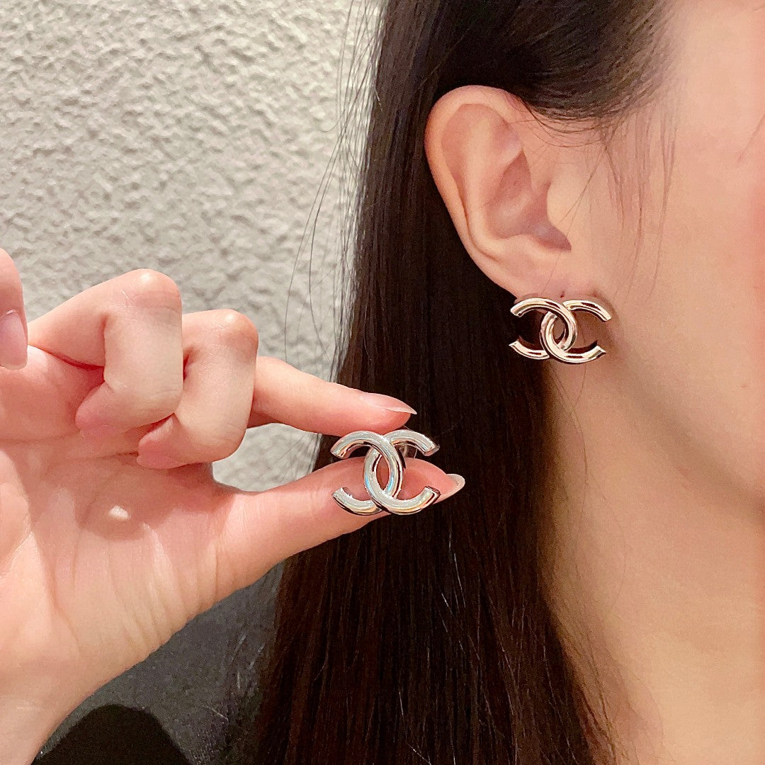 Martin Graham stud earrings in polished metal-tone – main product view