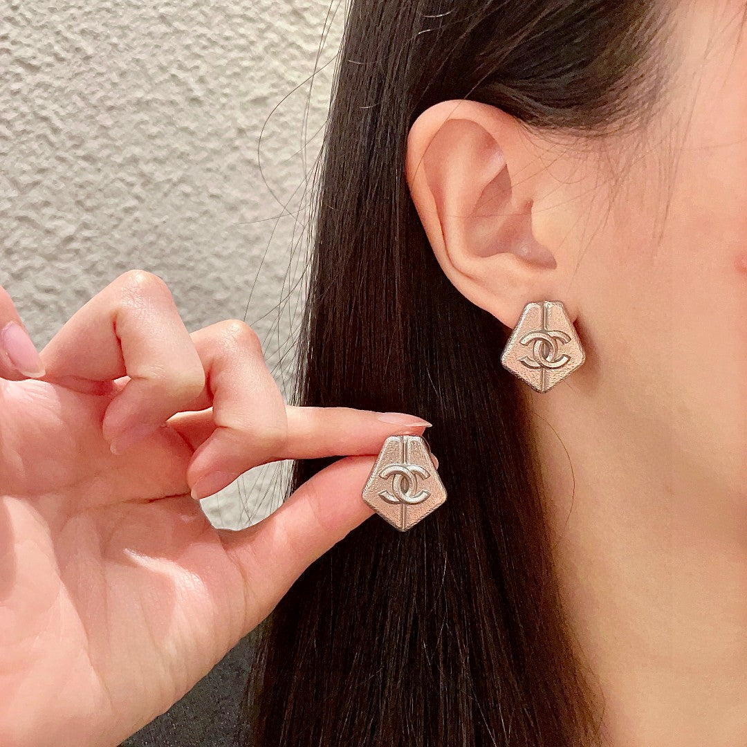 Martin Graham stud earrings in polished metal-tone – main product view