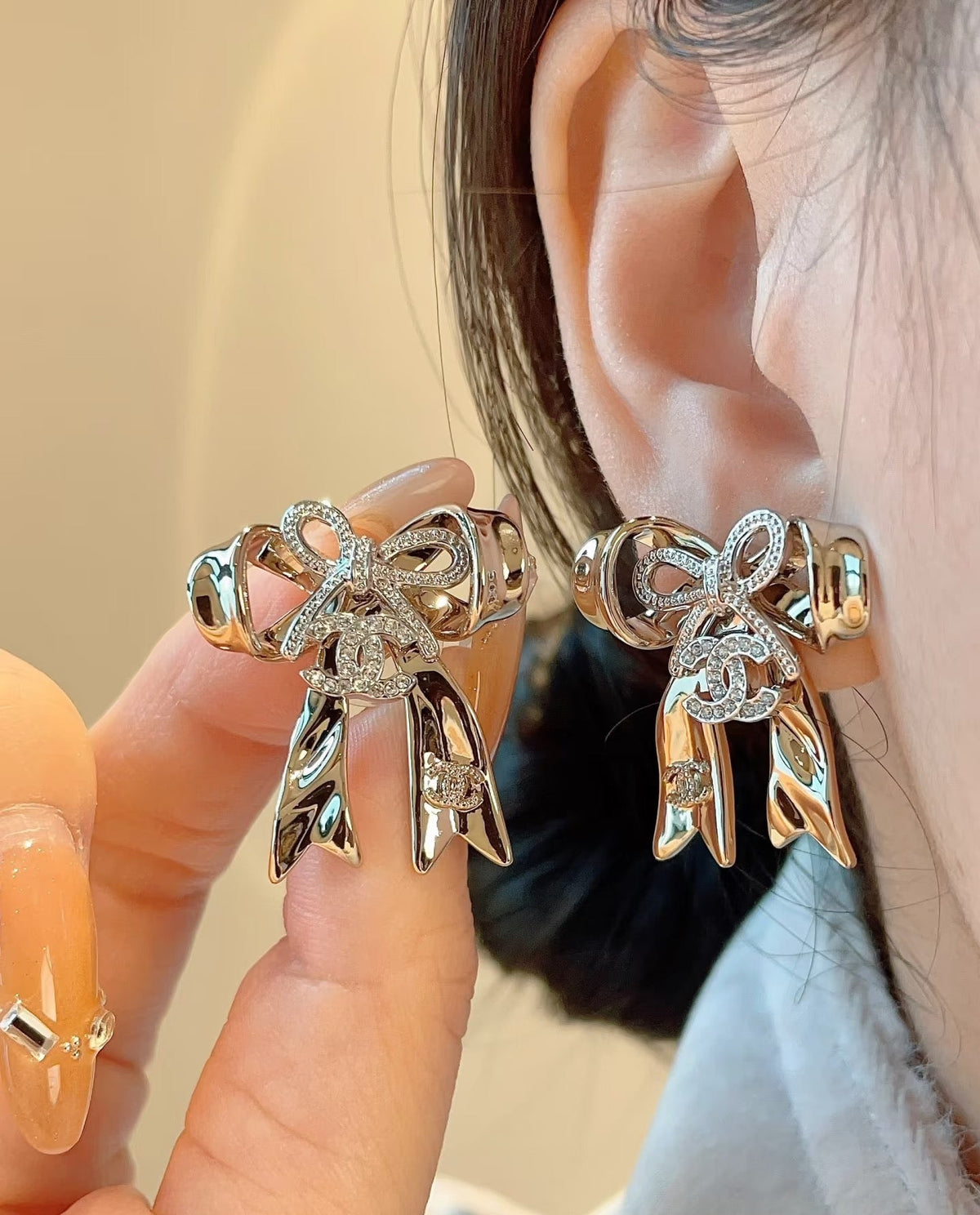 Martin Graham Bow stud earrings in polished metal-tone – main product view