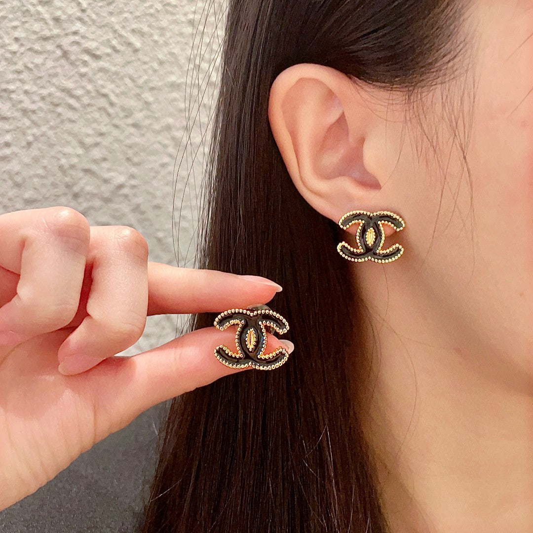 Martin Graham stud earrings in polished metal-tone – main product view