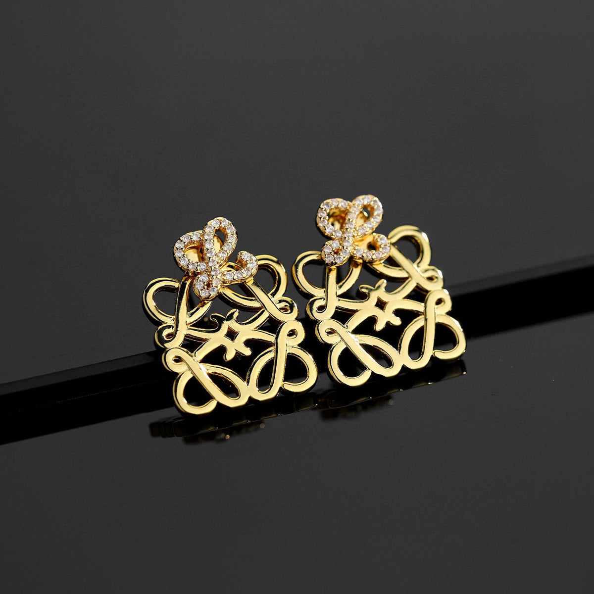 Martin Graham stud earrings in polished metal-tone – main product view