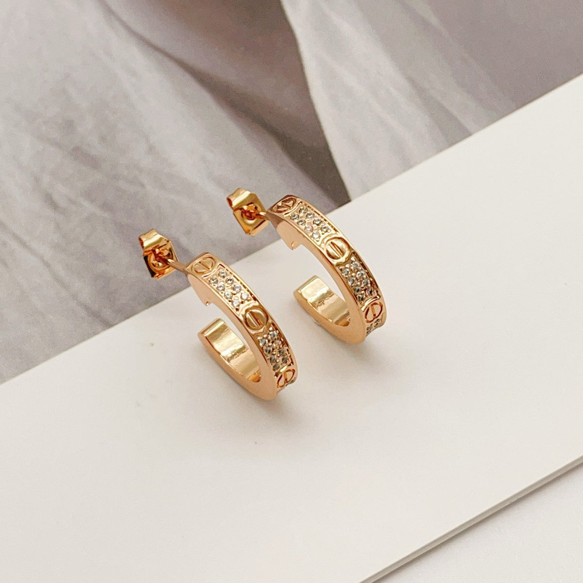 Martin Graham stud earrings in polished metal-tone – main product view