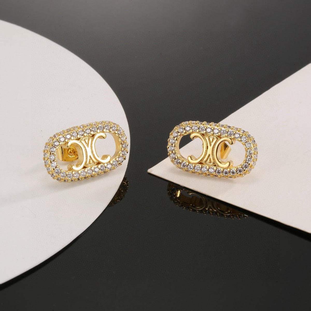 Martin Graham stud earrings in polished metal-tone – main product view