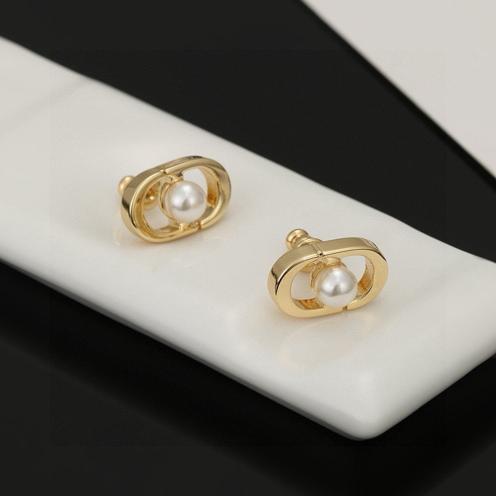 Martin Graham stud earrings in polished metal-tone – main product view