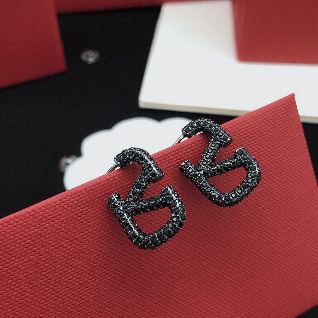 Martin Graham stud earrings in polished metal-tone – main product view