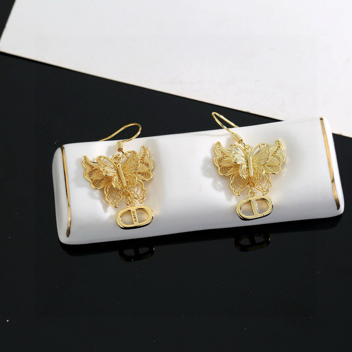 Martin Graham stud earrings in polished metal-tone – main product view
