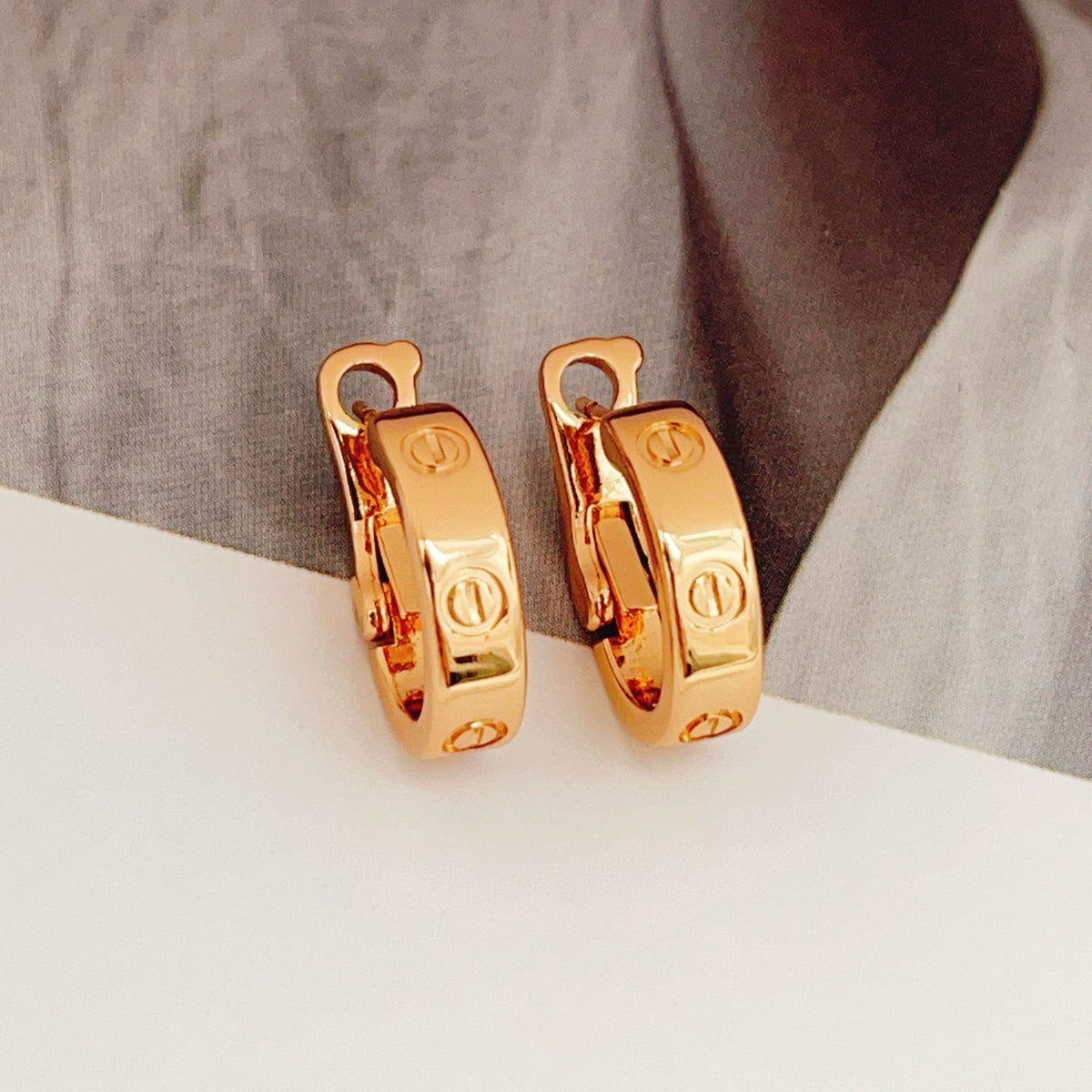 Martin Graham stud earrings in polished metal-tone – main product view