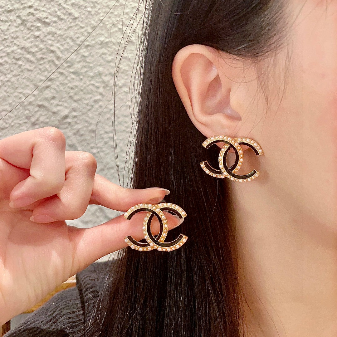 Martin Graham stud earrings in polished metal-tone – main product view