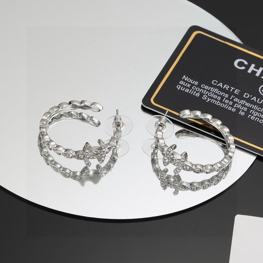 Martin Graham stud earrings in polished metal-tone – main product view