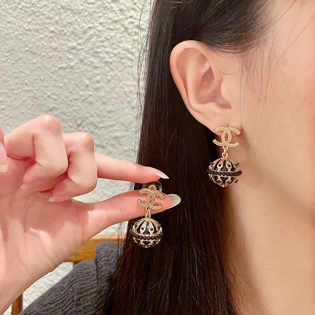 Martin Graham stud earrings in polished metal-tone – main product view