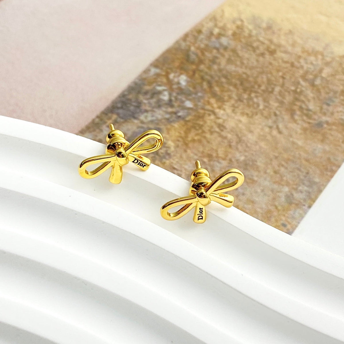 Martin Graham stud earrings in polished metal-tone – main product view