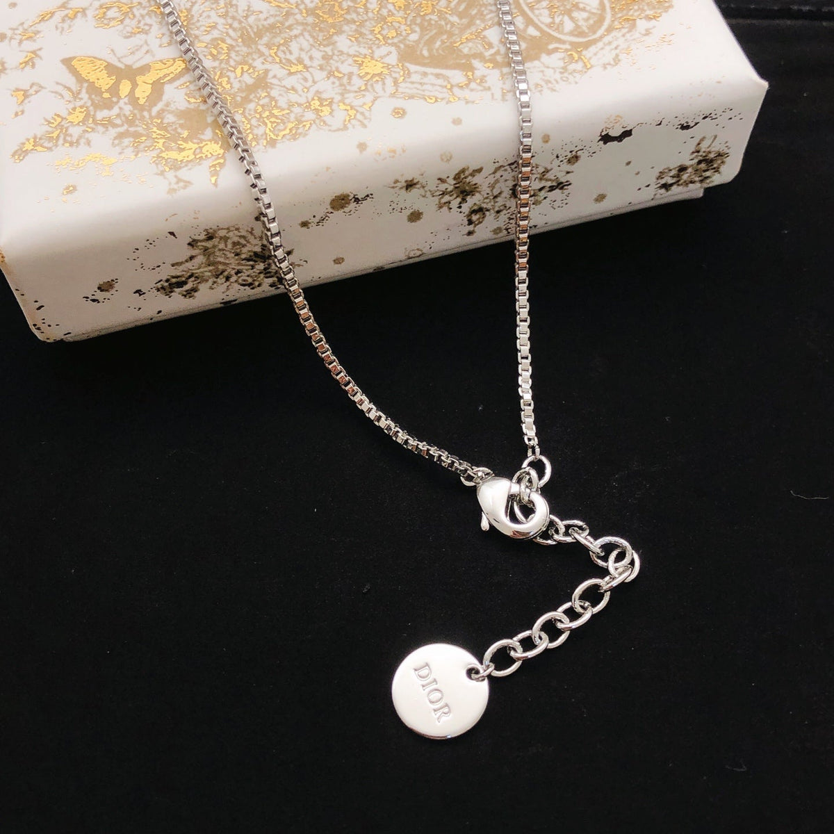 Martin Graham pendant necklace in polished metal-tone – front view
