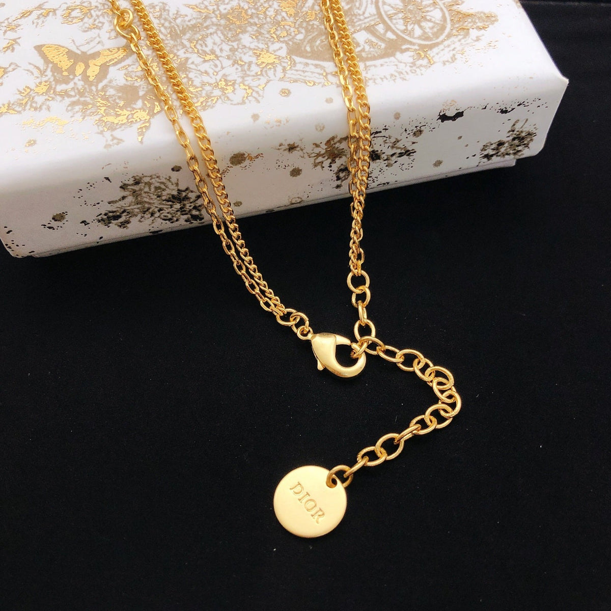 Martin Graham pendant necklace in polished metal-tone – front view