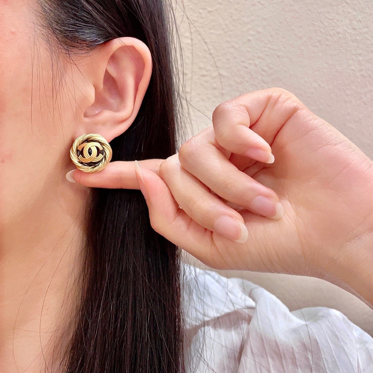 Martin Graham stud earrings in polished metal-tone – front product view